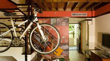 A staircase with a bicycle rack holding two bicycles.