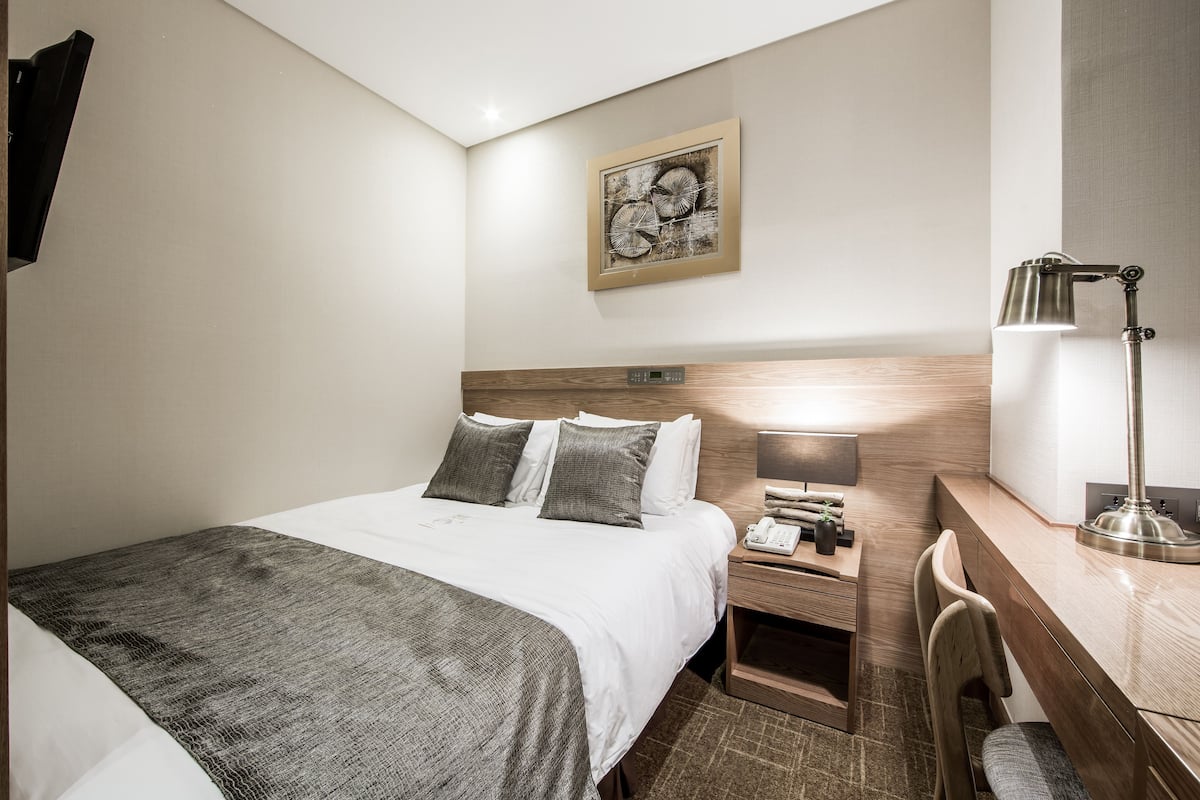 Premium bedding, down duvets, in-room safe, desk