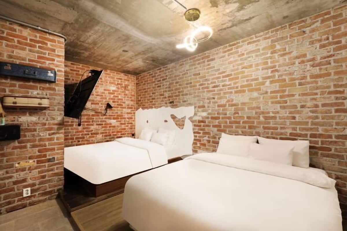 Premium bedding, down duvets, memory-foam beds, in-room safe