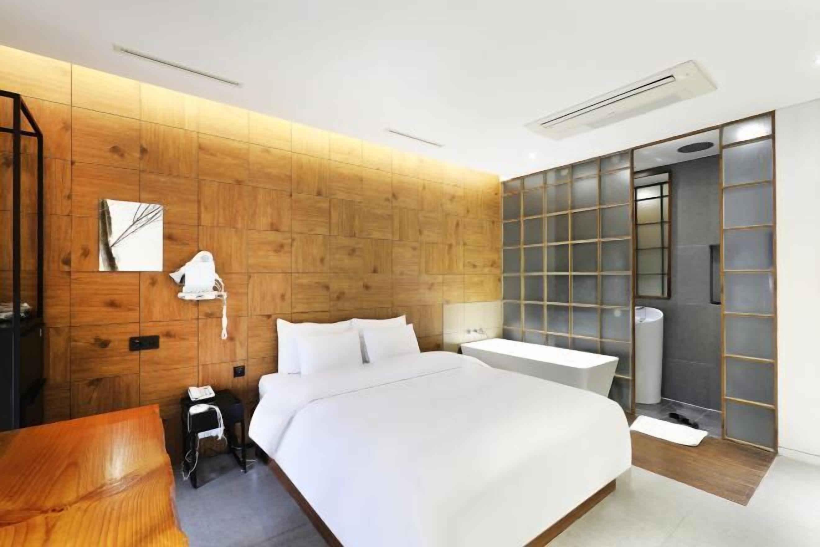 Premium bedding, down duvets, memory-foam beds, in-room safe