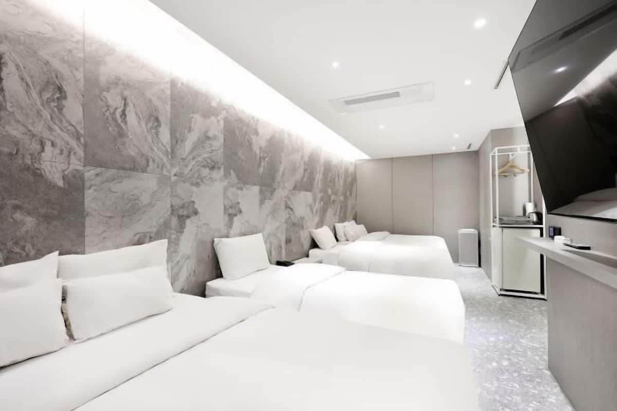 Premium bedding, down duvets, memory-foam beds, in-room safe