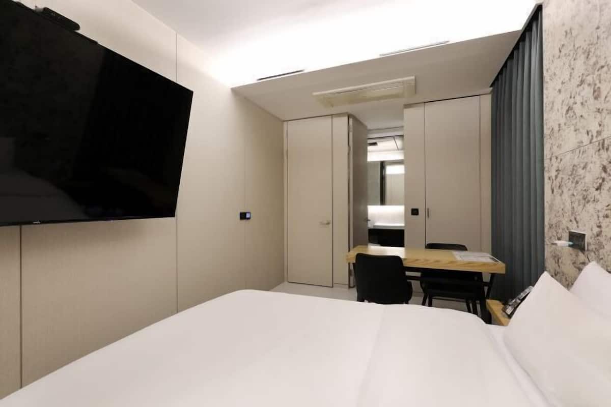 Premium bedding, down duvets, memory-foam beds, in-room safe