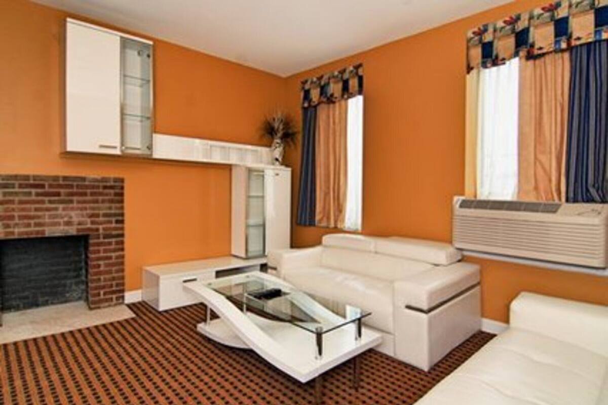 Executive Suite, 1 King Bed, Non Smoking, Jetted Tub (2 Separate Rooms) | Desk, laptop workspace, soundproofing, iron/ironing board