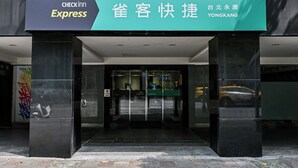 A hotel entrance with a sign for Checkinn Express and a sign for YONGKANG. - CHECK inn Express Taipei YongKang (Taipei)