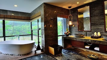 Deluxe Room Themed Water | Bathroom | Separate bathtub and shower, jetted bath, rainfall showerhead