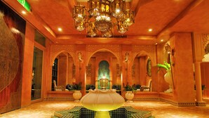 A luxurious lobby with a central fountain, ornate arches, and a chandelier. - Amanda Hotel Kenting (Hengchun)