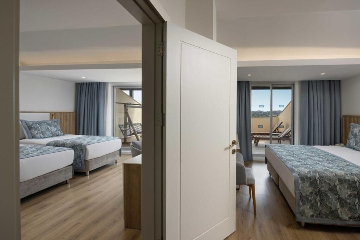 Family Room with Terrace | Minibar (free items), in-room safe, desk, WiFi (free)