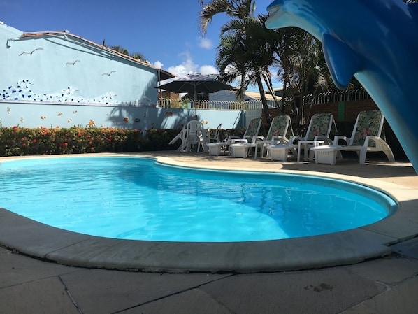 Outdoor pool, pool umbrellas, sun loungers