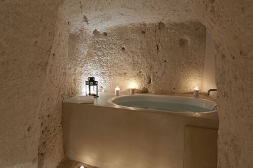Suite Deluxe, tina, vista a la ciudad | Baño | Regadera, regadera tipo lluvia, secadora de cabello, bidet