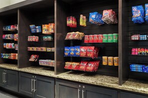 A grocery store with shelves stocked with various snacks and beverages. - Four Points by Sheraton Williston (Williston)