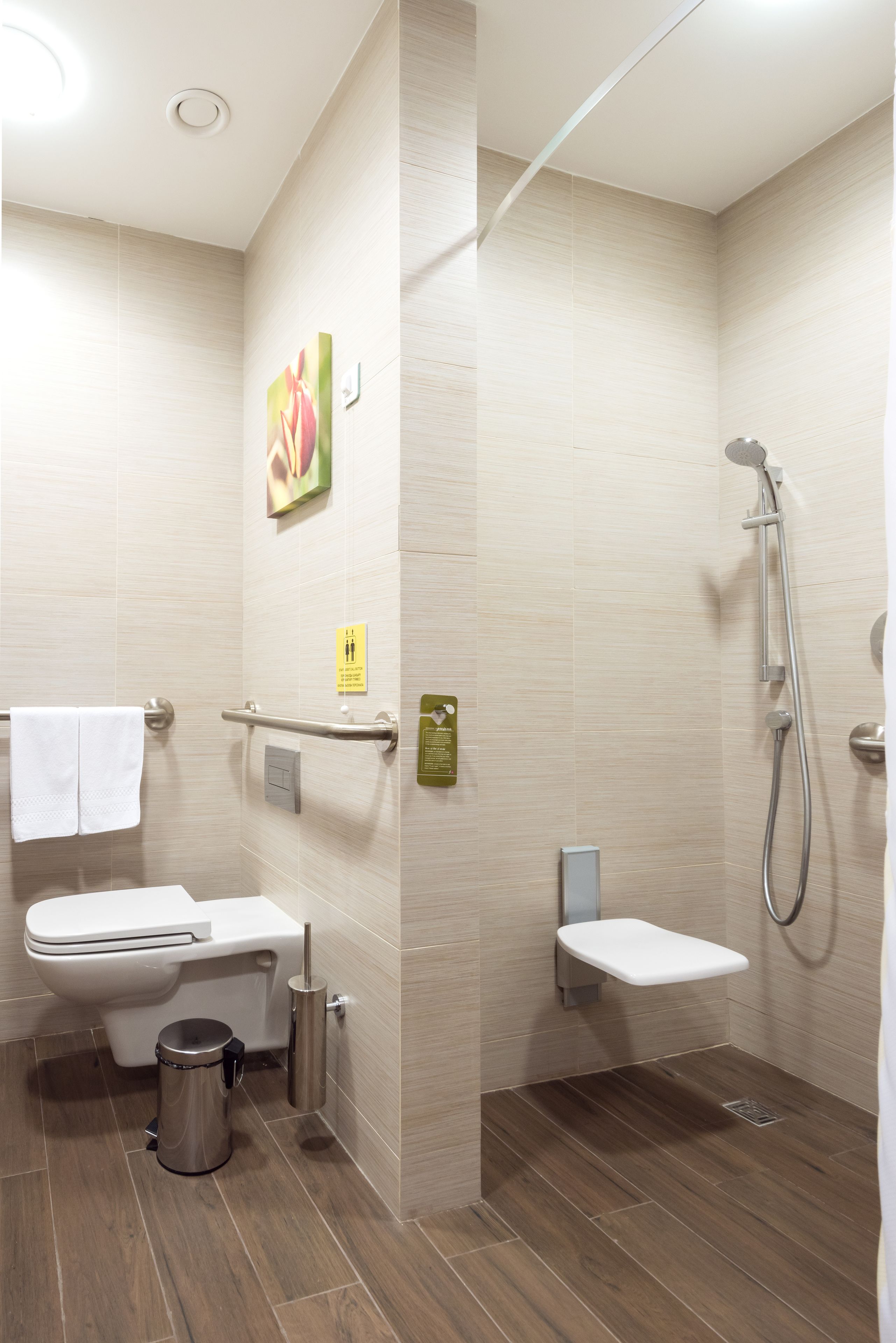 A modern bathroom with a toilet, bidet, and shower.
