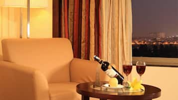 Premium Room | Living area | 32-inch LCD TV with cable channels, TV, pay movies