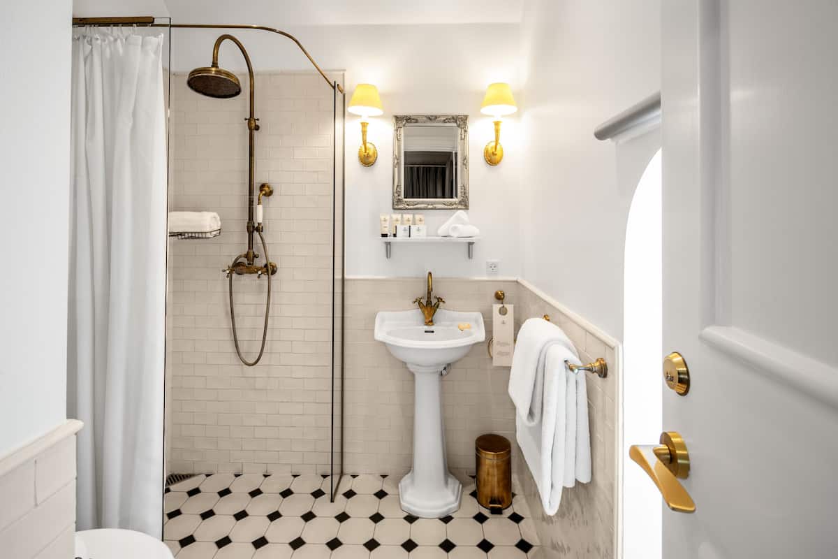 standard double room, annex building | bathroom | shower, designer toiletries, hair dryer, towels