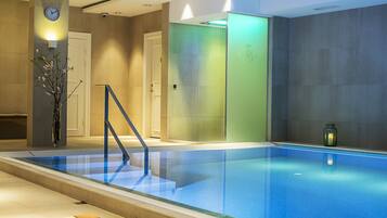 Indoor pool, open 7:00 AM to 9:00 PM, pool loungers