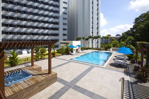 Outdoor pool, open 7:00 AM to 9:00 PM, pool loungers