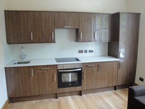 Full-size fridge, microwave, stovetop, coffee/tea maker