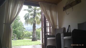 Standard Double Room, 1 Queen Bed, Patio, Garden View | Living area | 32-inch flat-screen TV with digital channels, TV, Netflix