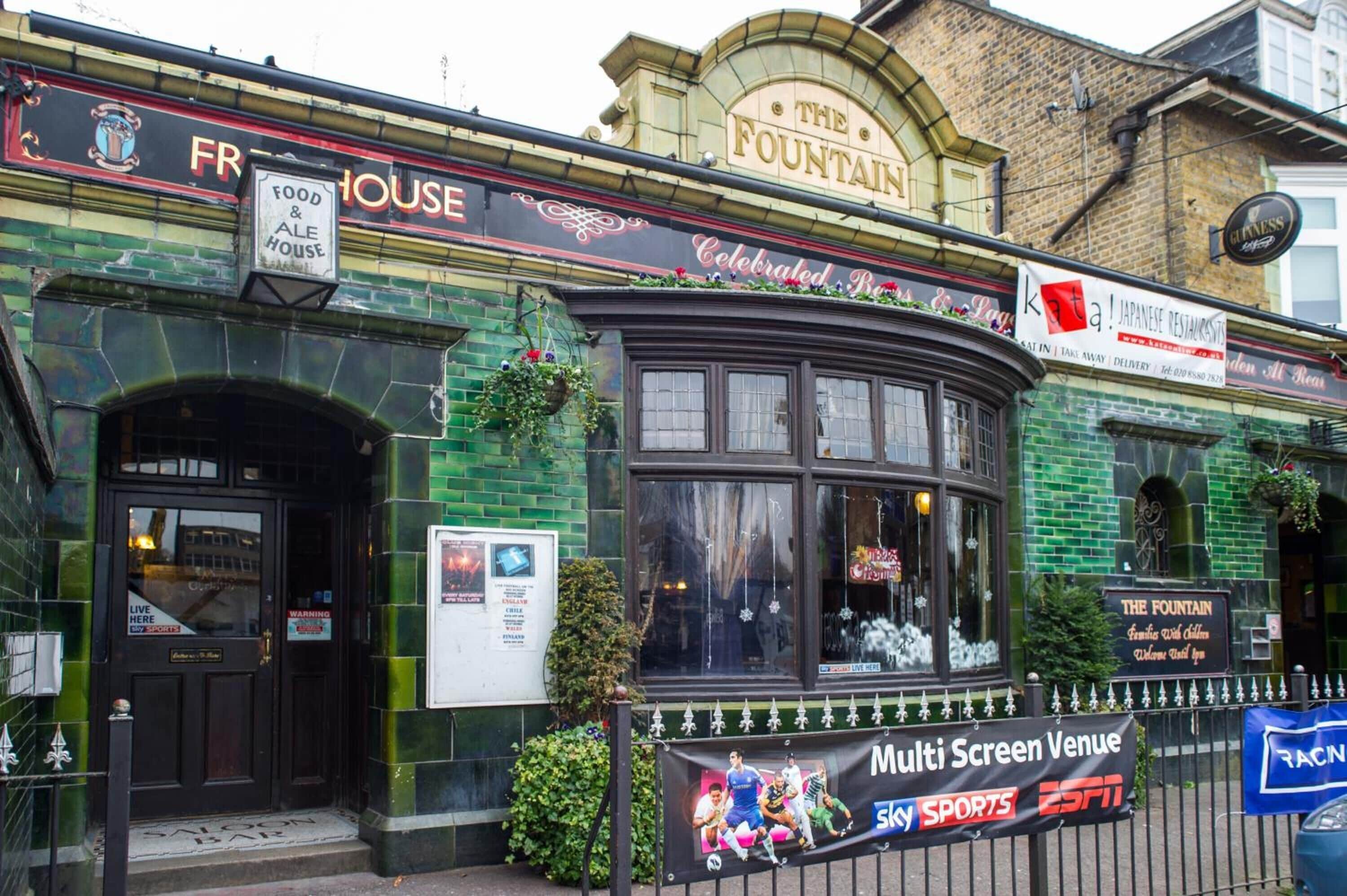 A building with a sign for "The Fountain" and "Food & Ale House".