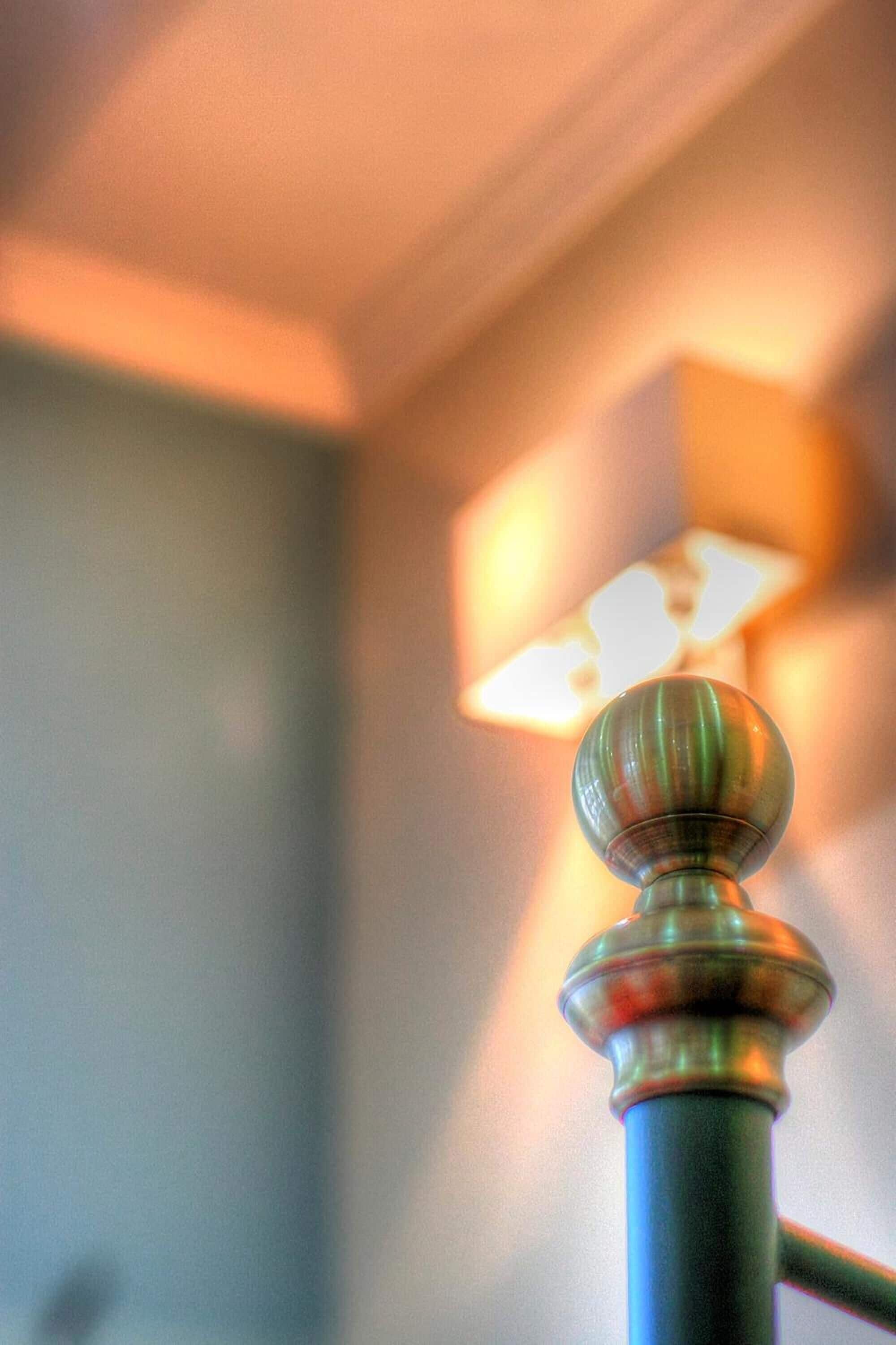 A close-up of a door handle with a round knob, part of a room's interior.