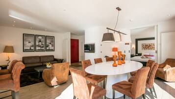 villa with double rain-shower and bubble-bath | Living area | 32-inch TV with cable channels