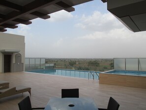 Outdoor pool, sun loungers - Park Inn by Radisson Gurgaon Bilaspur (Gurugram)