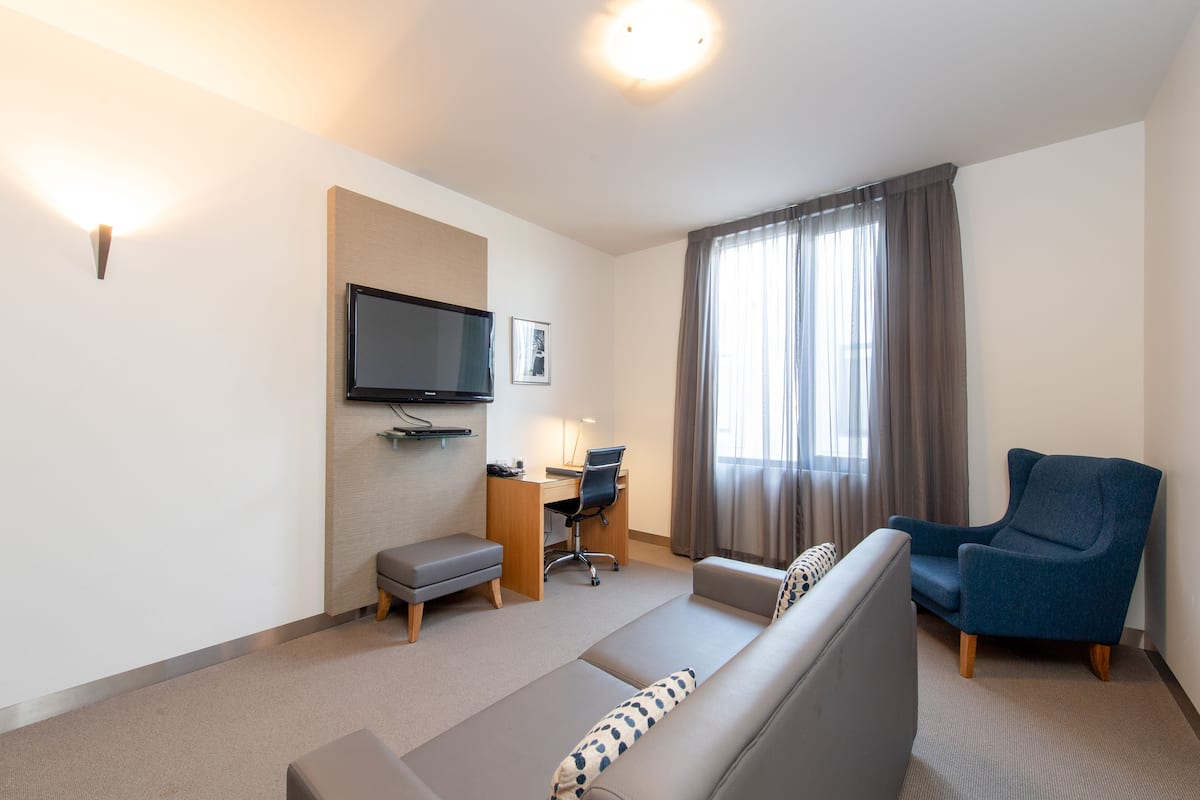 One Bedroom Suite | Living area | TV