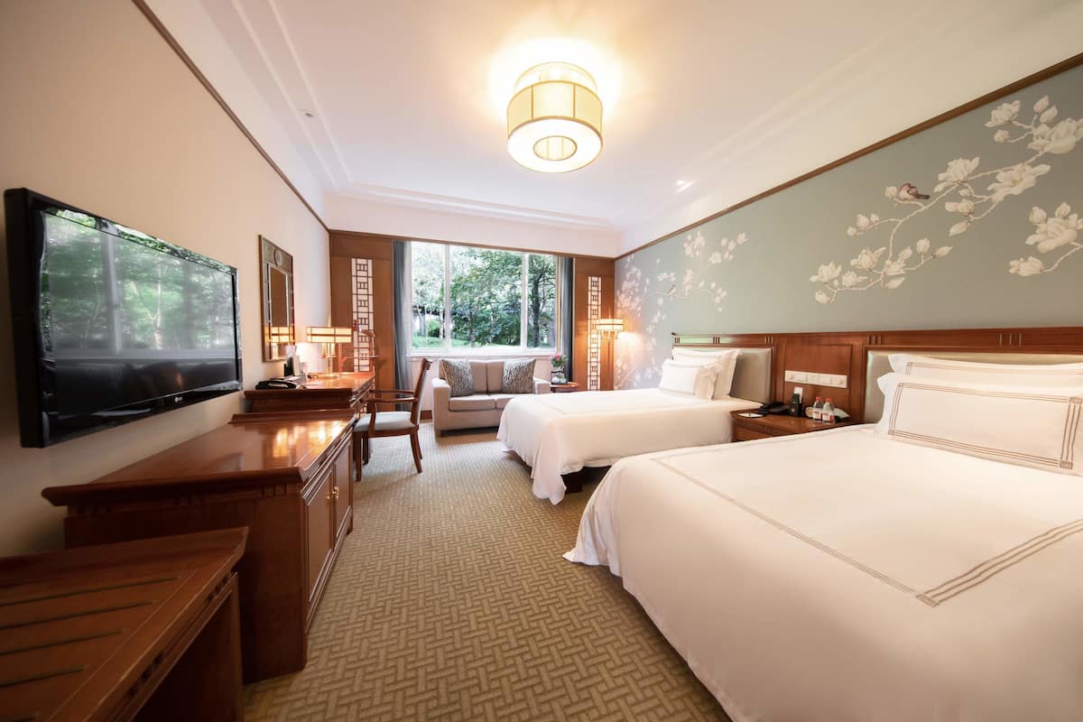 Rum - utsikt mot trädgården (Garden view Twin bed room) | 1 sovrum, sängtillbehör av högsta kvalitet och minibar
