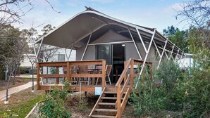 A tented accommodation with a wooden deck and stairs leading to the entrance. - Discovery Parks - Dubbo (Dubbo)