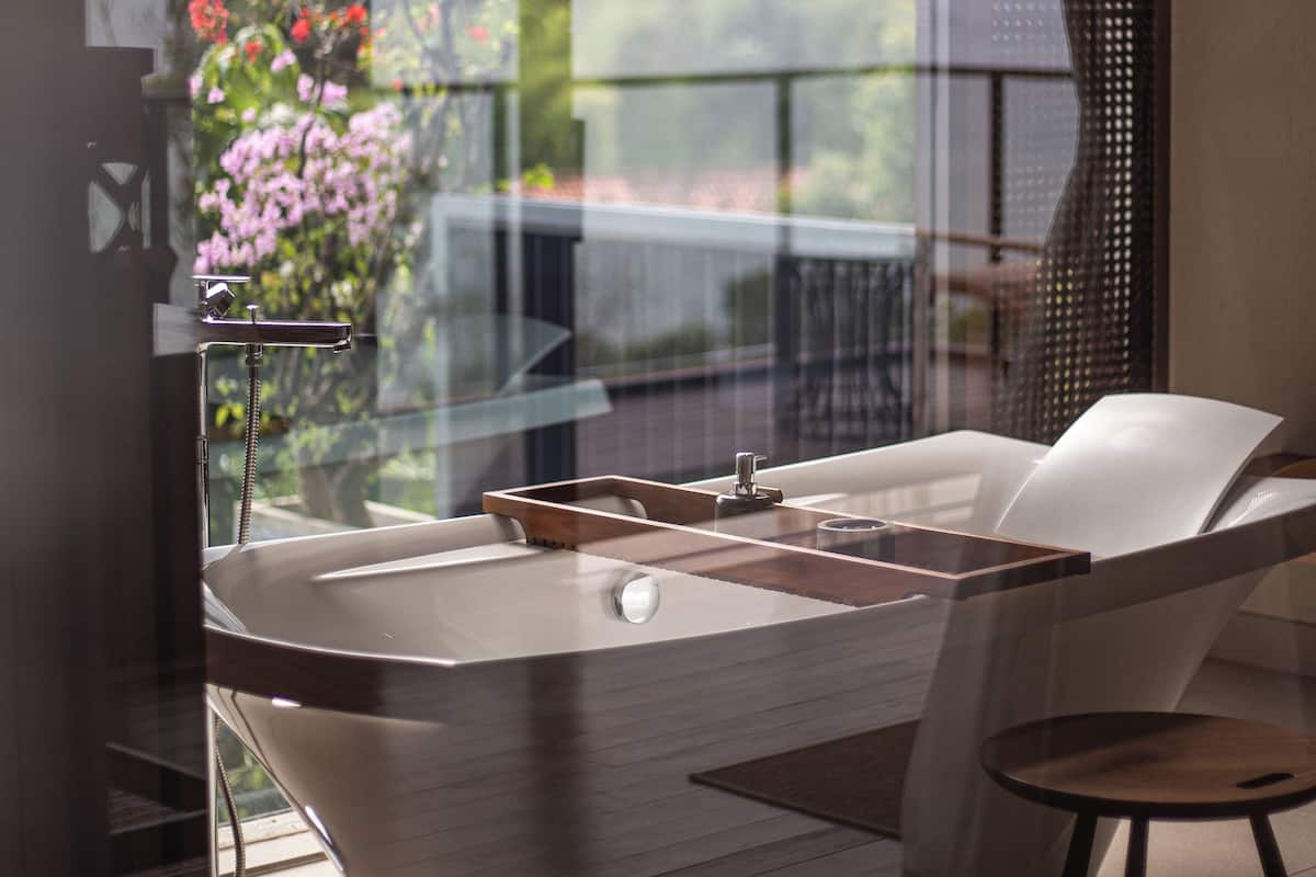 founder's home | bathroom | separate bathtub and shower, eco-friendly toiletries, hair dryer