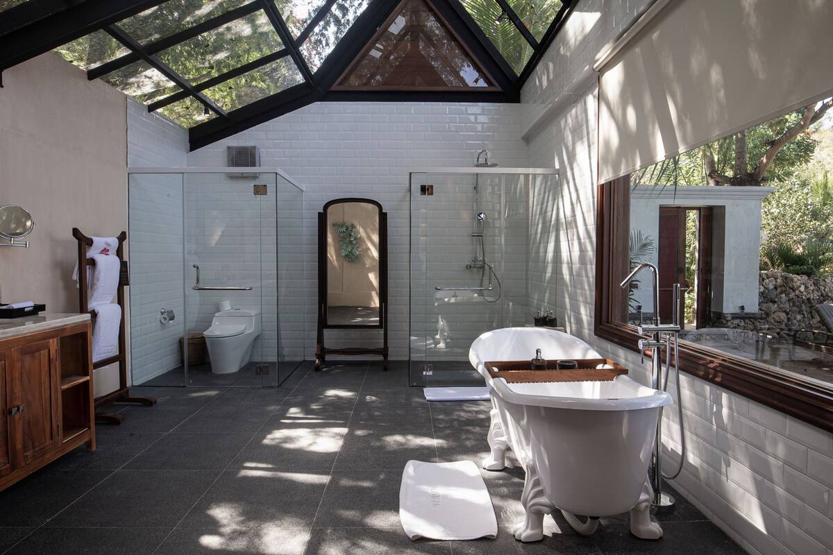 executive oceanfront residence | bathroom | separate bathtub and shower, eco-friendly toiletries, hair dryer