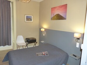 Desk, blackout drapes, soundproofing, iron/ironing board