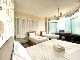 Habitación familiar (Deluxe) | Sistema de insonorización, wifi gratis, ropa de cama