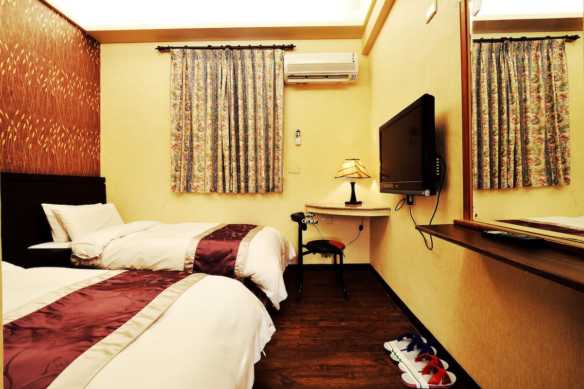 Economy Twin Room | Down comforters, blackout drapes, WiFi (free), bed sheets
