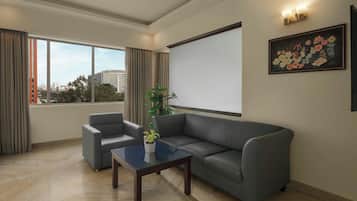 Suite, 1 Queen Bed, City View | Living room | 42-inch LED TV with satellite channels, TV