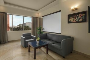 Suite, 1 Queen Bed, City View | Living room | 42-inch LED TV with satellite channels, TV