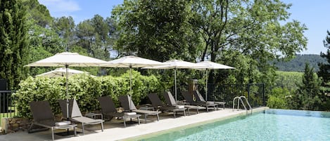Indoor pool, seasonal outdoor pool, pool umbrellas, pool loungers
