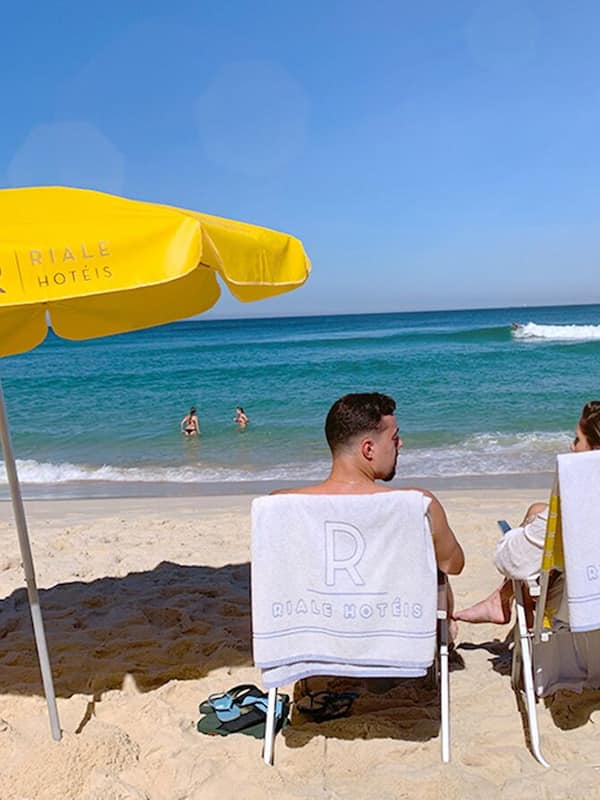 Beach nearby, white sand, beach umbrellas, beach towels