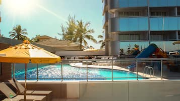 Outdoor pool, open 9:00 AM to 9:00 PM, pool loungers, lifeguards on site