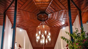 A spacious lobby with a high ceiling, a central chandelier, and a staircase leading to upper floors. - Murat Paşa Konağı Boutique Hotel (Ortaca)