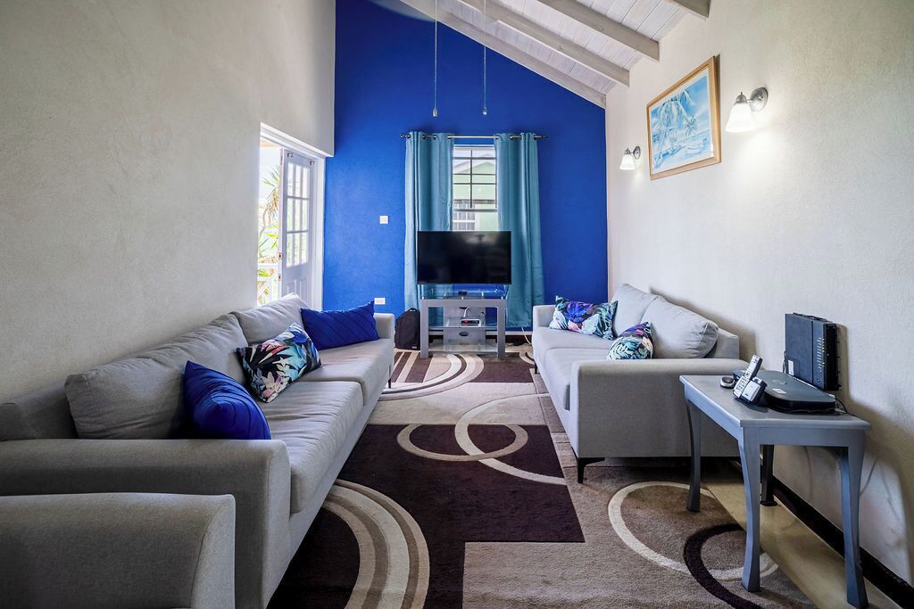 Apartment, 2 Bedrooms | Living area | 42-inch flat-screen TV with cable channels, TV, DVD player