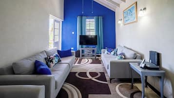 Apartment, 2 Bedrooms | Living area | 42-inch flat-screen TV with cable channels, TV, DVD player