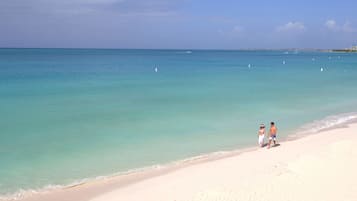 Beach nearby, white sand, beach towels