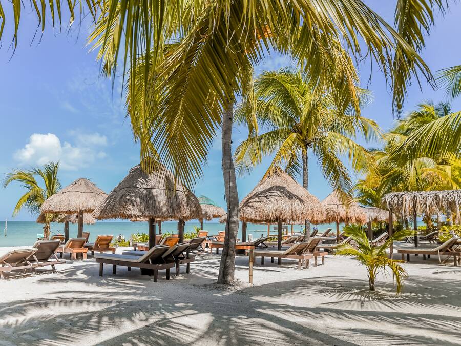 On the beach, white sand, sun loungers