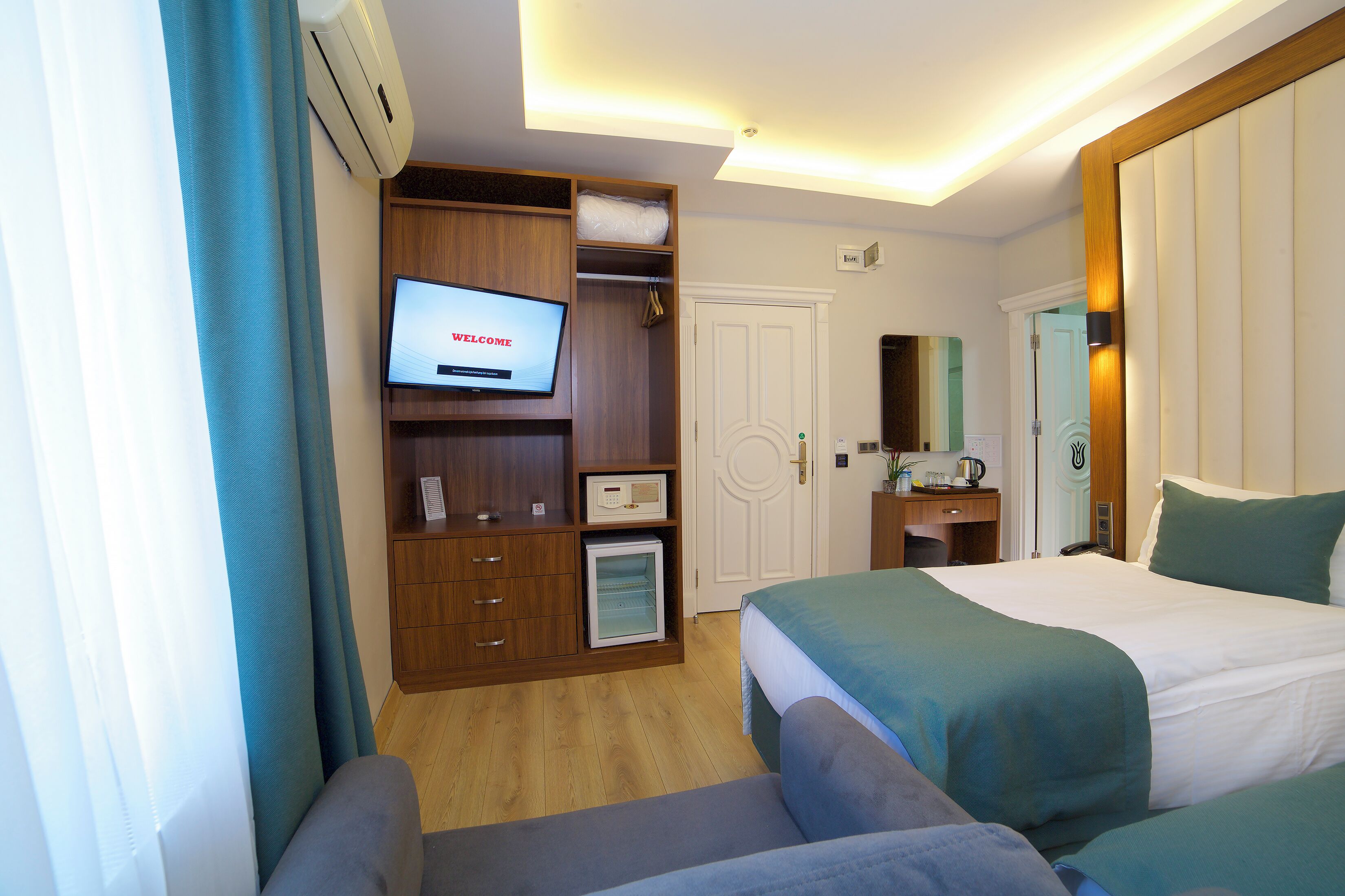 Habitació familiar | Roba de llit d'alta qualitat, minibar i caixa forta a l'habitació 
