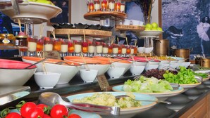 A buffet with various food items including salads, fruits, and desserts. - Weingart Black Tulip (Istanbul)