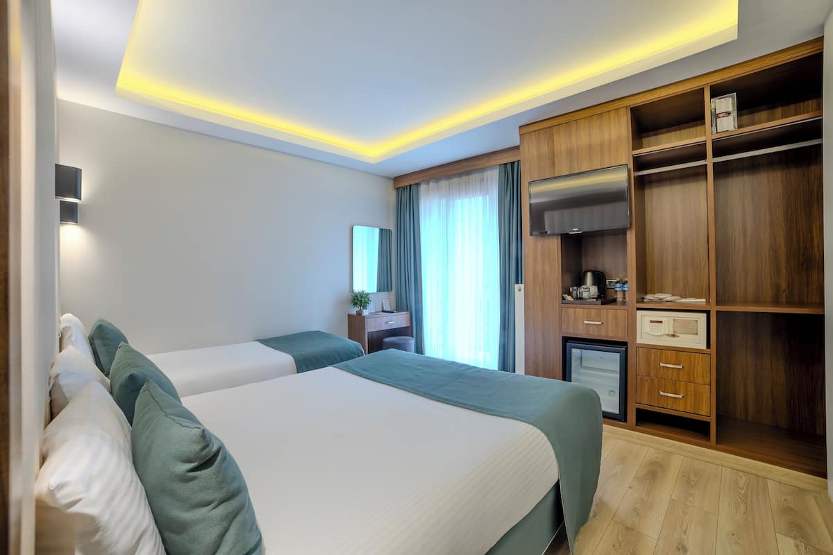 Standard Triple Room | Premium bedding, minibar, in-room safe, free WiFi