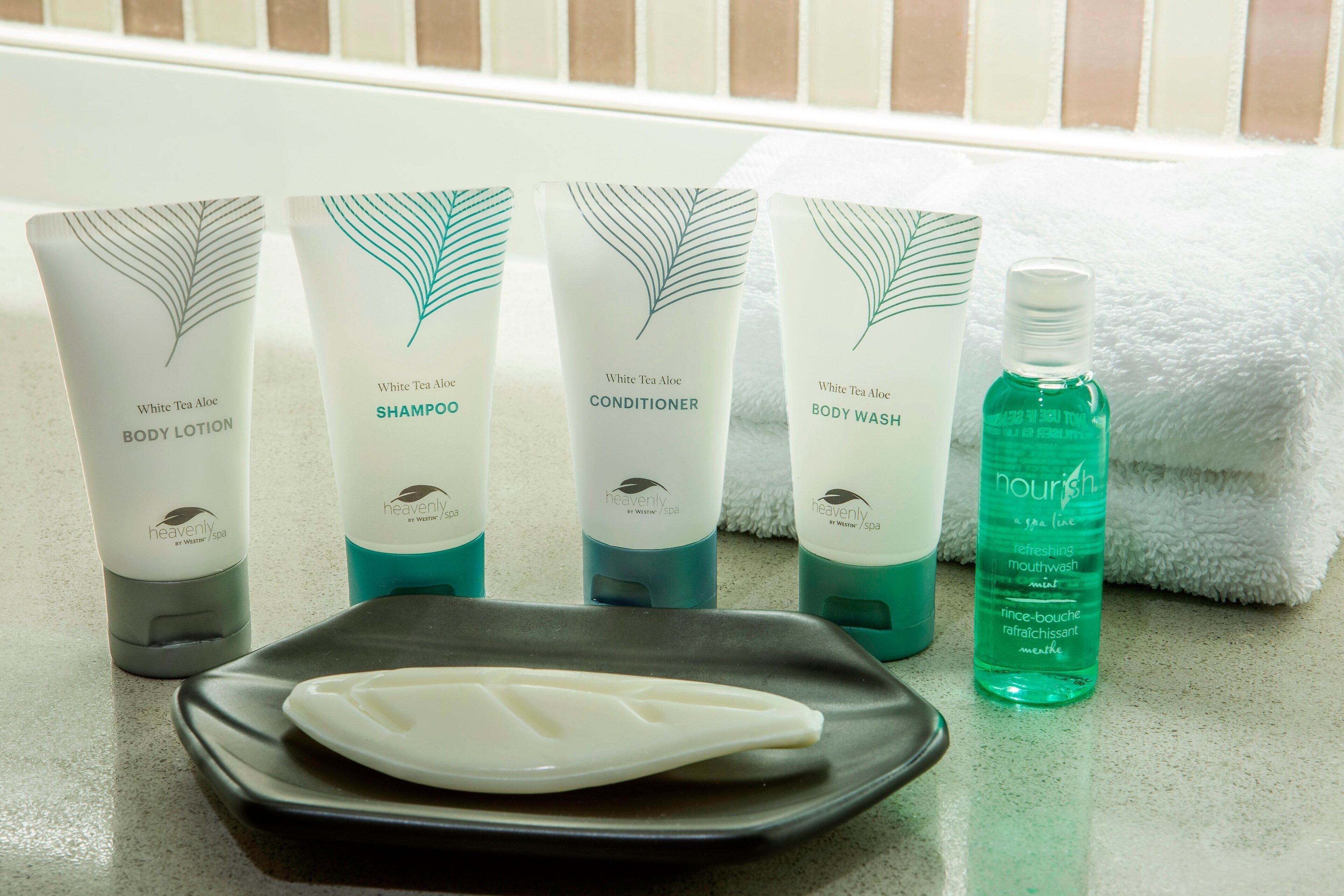 combined shower/bathtub, designer toiletries, hair dryer, bathrobes