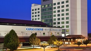 A Chase Center hotel with a modern design, featuring a prominent Westin logo on the building.