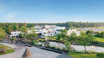 Stroll through the historic complex, surrounded by beautifully maintained gardens and a serene central pond with a fountain.