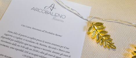 A hotel room brochure with a leaf-shaped decoration and a string of lights.